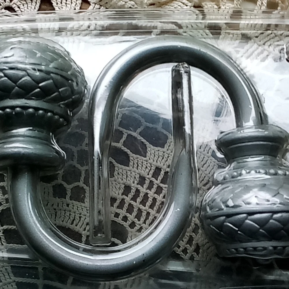 2 sets of gray metal curtain pull backs